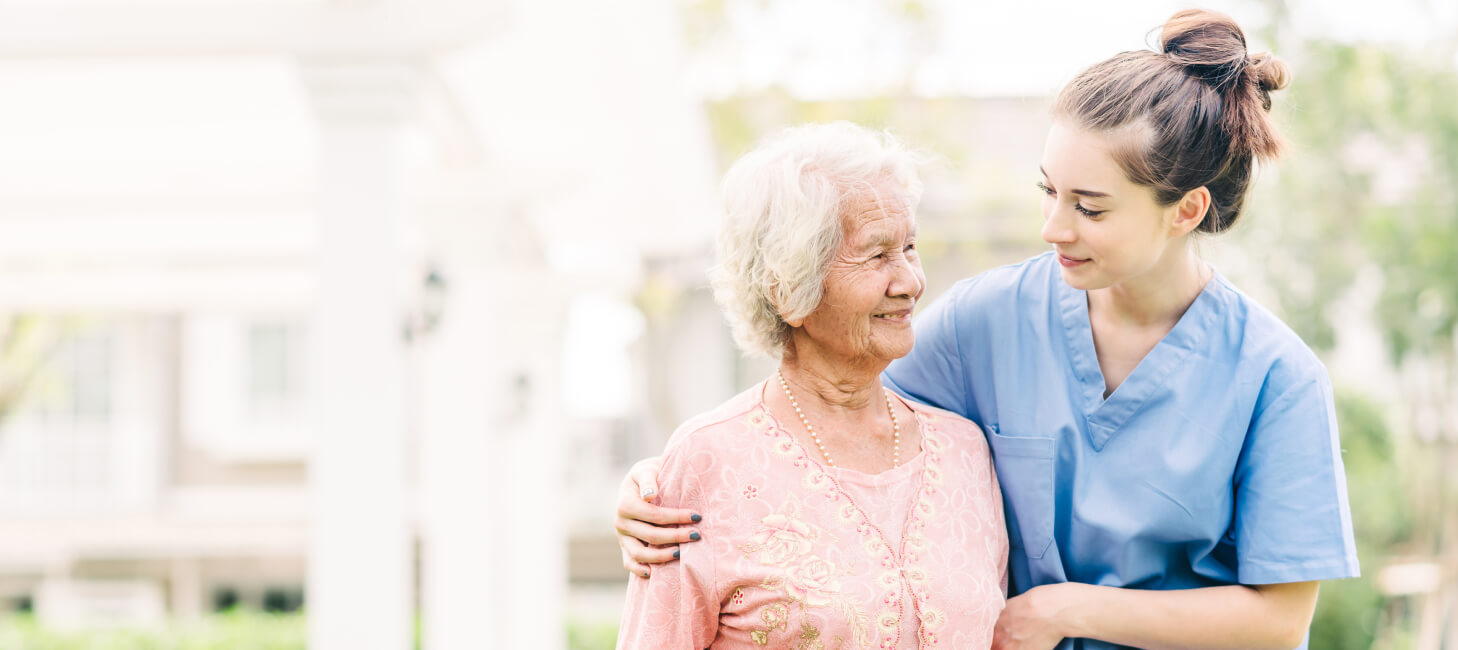 Caregiver in compassionate conversation with senior